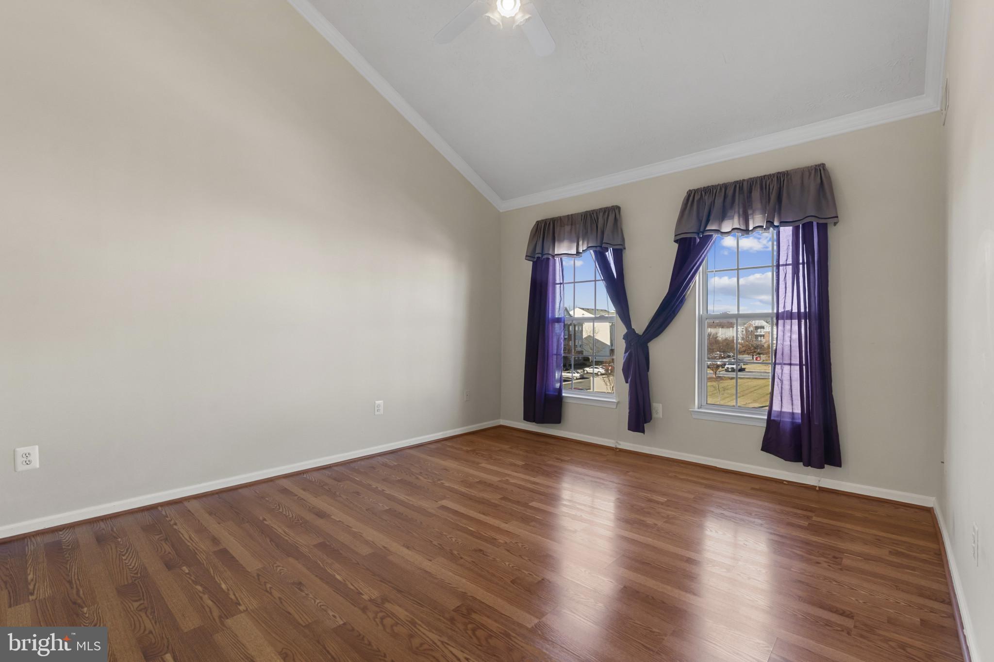 4868 Brightleaf Court, Unit 4868 Rosedale, MD 21237 - Photo 15 of 25 wooden floor in an empty room with a window