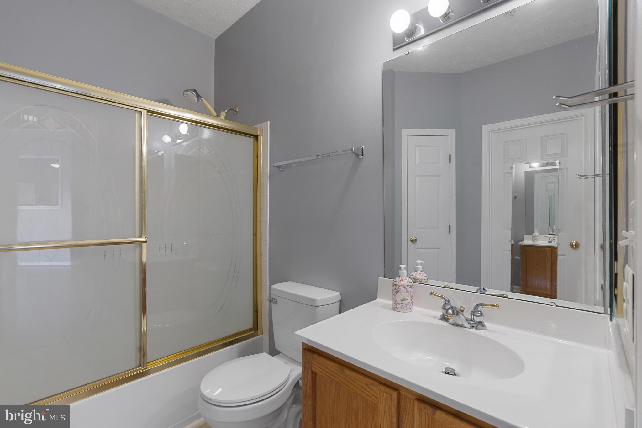 4868 Brightleaf Court, Unit 4868 Rosedale, MD 21237 - Photo 22 of 25 a bathroom with a sink toilet and shower