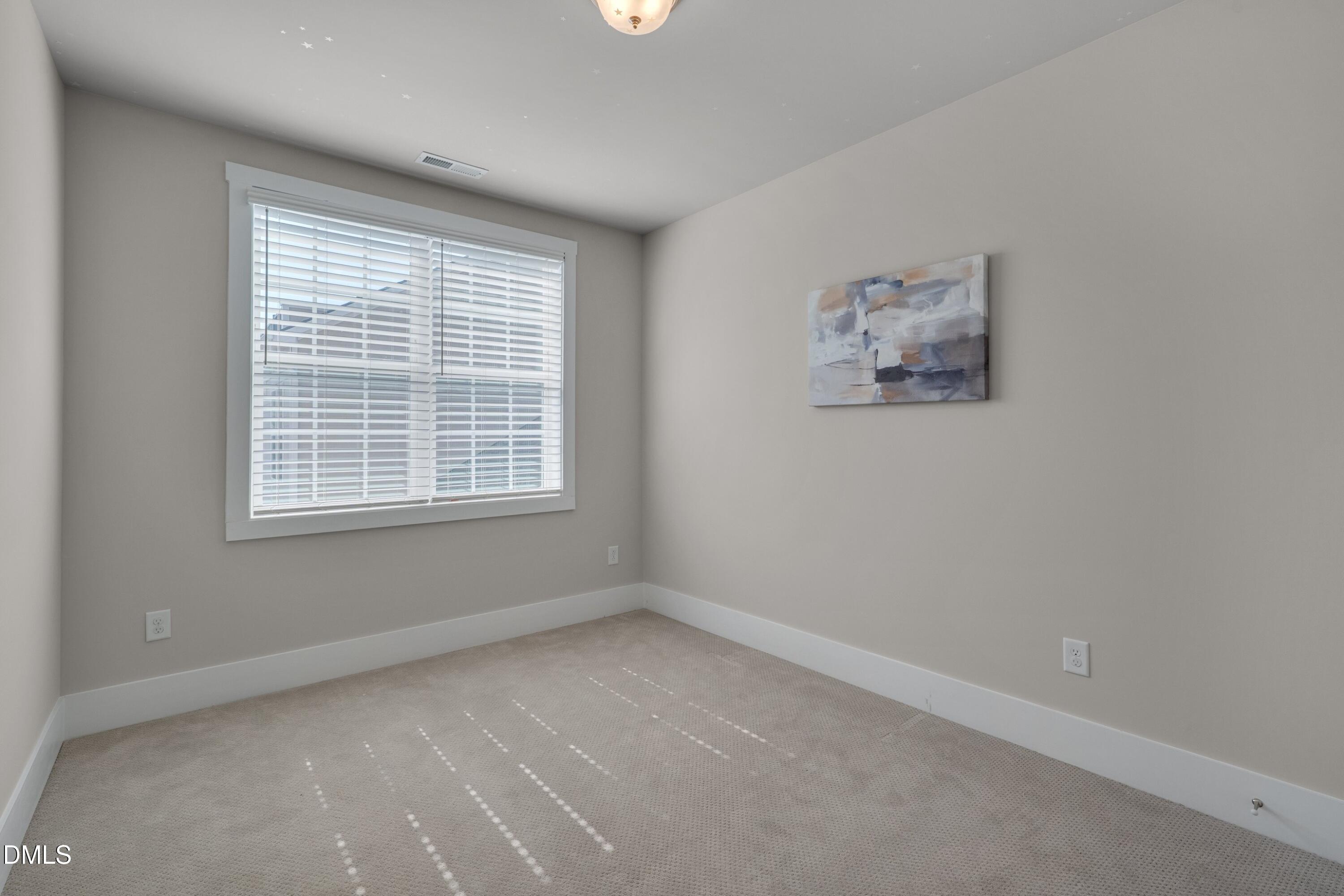 10330 Sablewood Drive, Unit 104 Raleigh, NC 27617 - Photo 13 of 28 a view of an empty room with a window