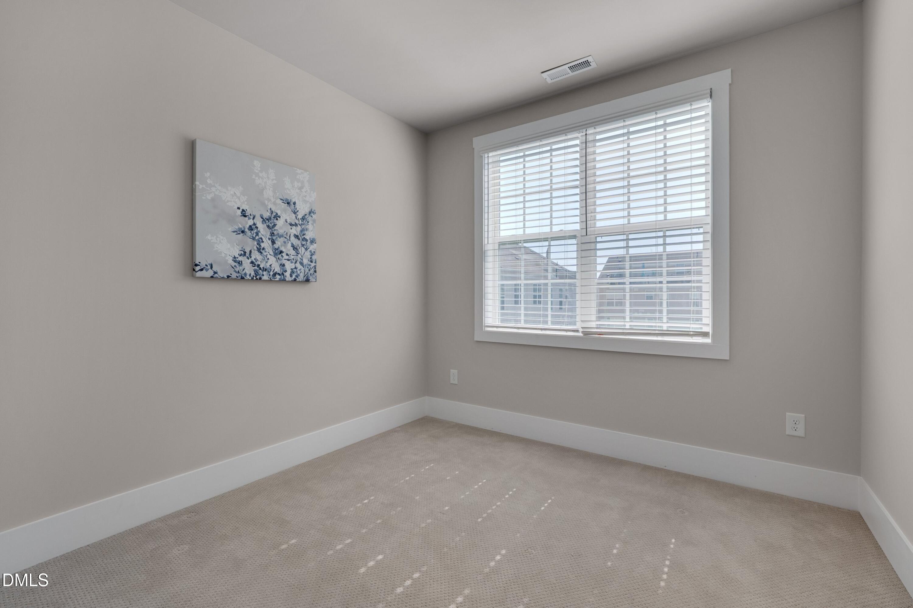 10330 Sablewood Drive, Unit 104 Raleigh, NC 27617 - Photo 15 of 28 an empty room with a window