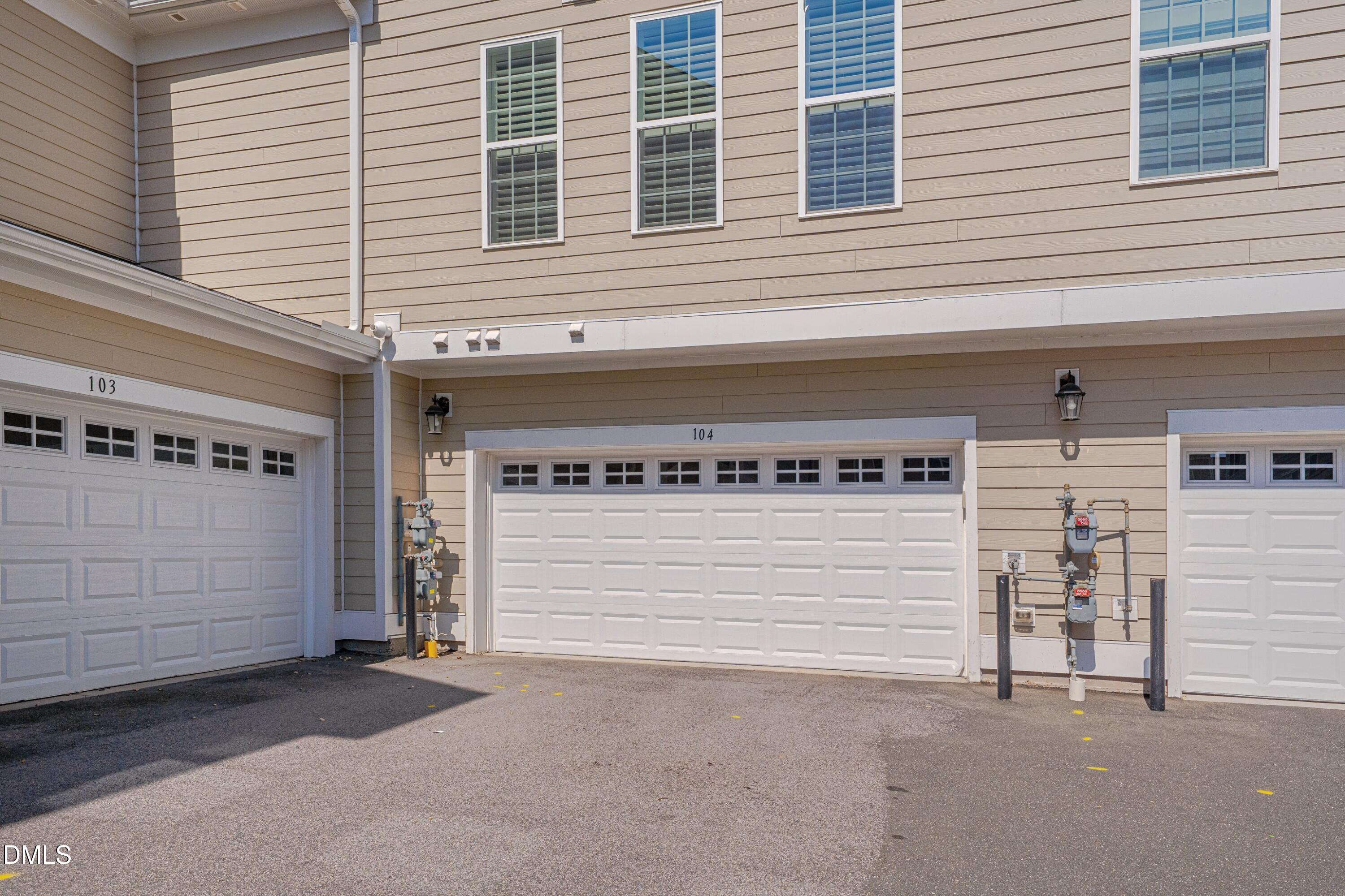 10330 Sablewood Drive, Unit 104 Raleigh, NC 27617 - Photo 19 of 28 a view of a house with garage