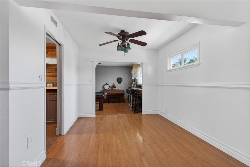 4194 Euclid Court Riverside, CA 92504 - Photo 7 of 29 Formal Dining Room with kitchen to the left and step-down bonus room for pool table and bar area straight ahead.