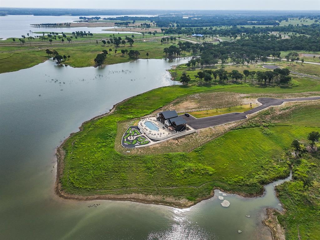 259 Lakeshore Terrace Windom, TX 75492 - Photo 34 of 35 an aerial view of a house with a yard and lake view