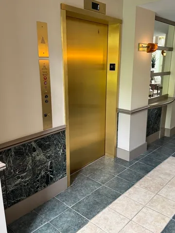 a view of a kitchen from the hallway