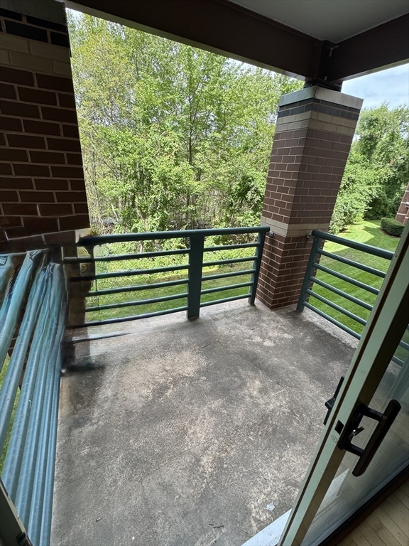273 Cambridge Road, Unit 202 Woburn, MA 01801 - Photo 17 of 38 a view of outdoor space and deck
