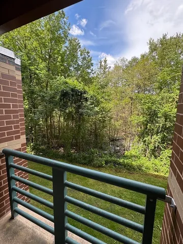 a view of a room with a kitchen