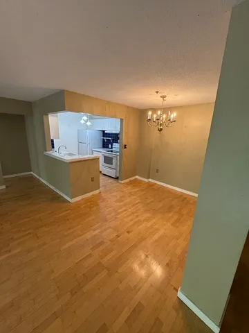 a view of a kitchen from the hallway