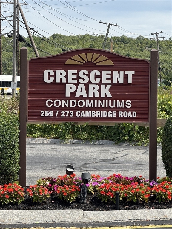 273 Cambridge Road, Unit 202 Woburn, MA 01801 - Photo 3 of 38 a view of sign board