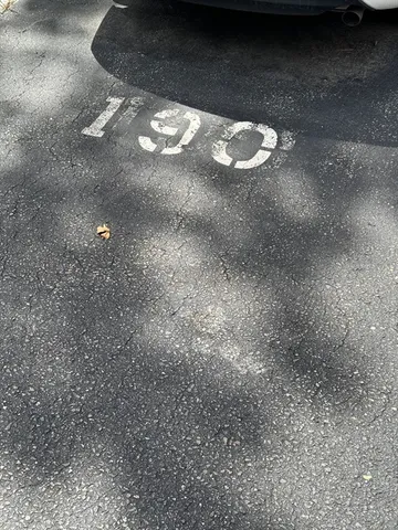 a view of a house with a swimming pool and sitting area