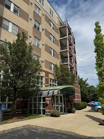 a front view of a building with street view