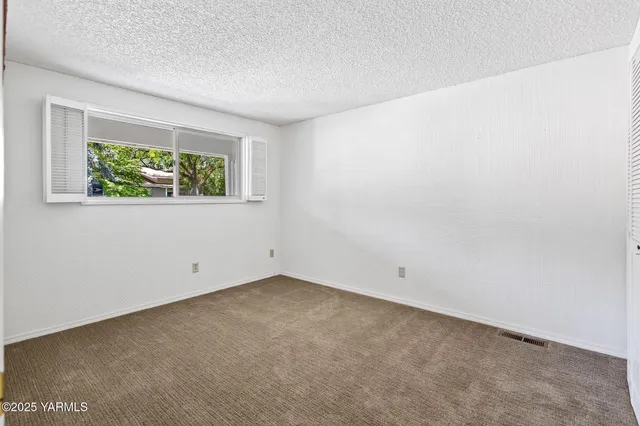 a bathroom with a granite countertop sink toilet a large mirror a bathtub and shower