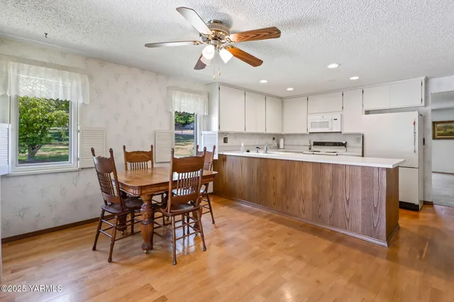 a view of a dining room with furniture window and outside view