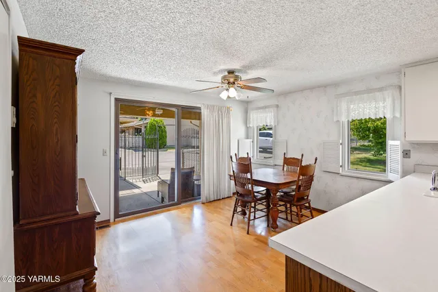a kitchen with a white refrigerator a sink and a stove