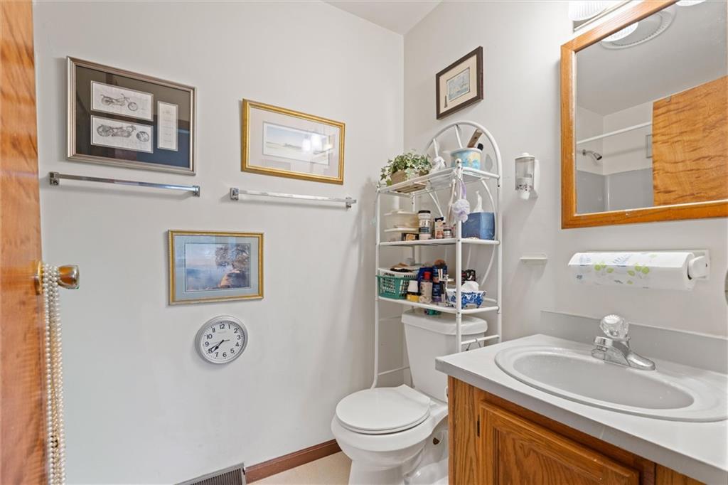 2997 Spangler Road Hermitage, PA 16148 - Photo 14 of 43 a bathroom with a toilet a sink and a mirror