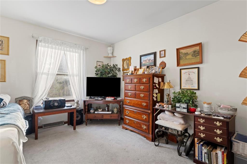 2997 Spangler Road Hermitage, PA 16148 - Photo 19 of 43 a living room with furniture and a flat screen tv