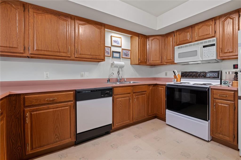 2997 Spangler Road Hermitage, PA 16148 - Photo 10 of 43 a kitchen with stainless steel appliances granite countertop a sink and cabinets