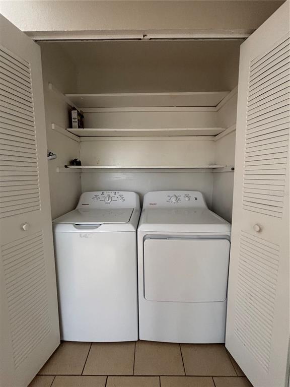 404 Banyon Tree Circle, Unit 200 Maitland, FL 32751 - Photo 3 of 11 a utility room with dryer and washer