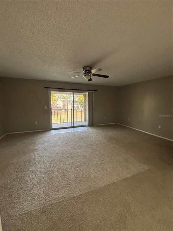 404 Banyon Tree Circle, Unit 200 Maitland, FL 32751 - Photo 5 of 11 a view of an empty room with a window