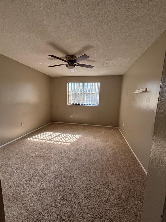 404 Banyon Tree Circle, Unit 200 Maitland, FL 32751 - Photo 6 of 11 an empty room with a empty space and windows