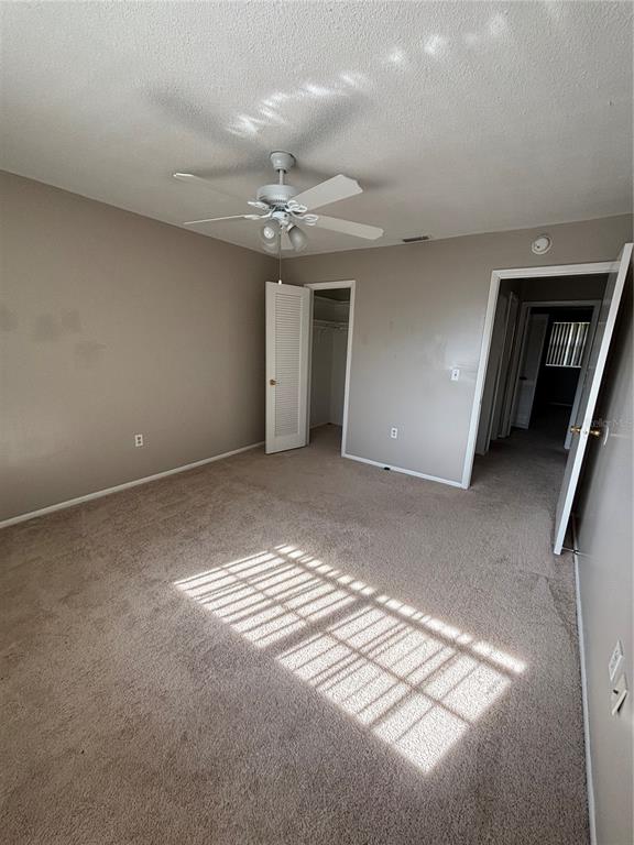 404 Banyon Tree Circle, Unit 200 Maitland, FL 32751 - Photo 7 of 11 a view of a livingroom with a ceiling fan and window