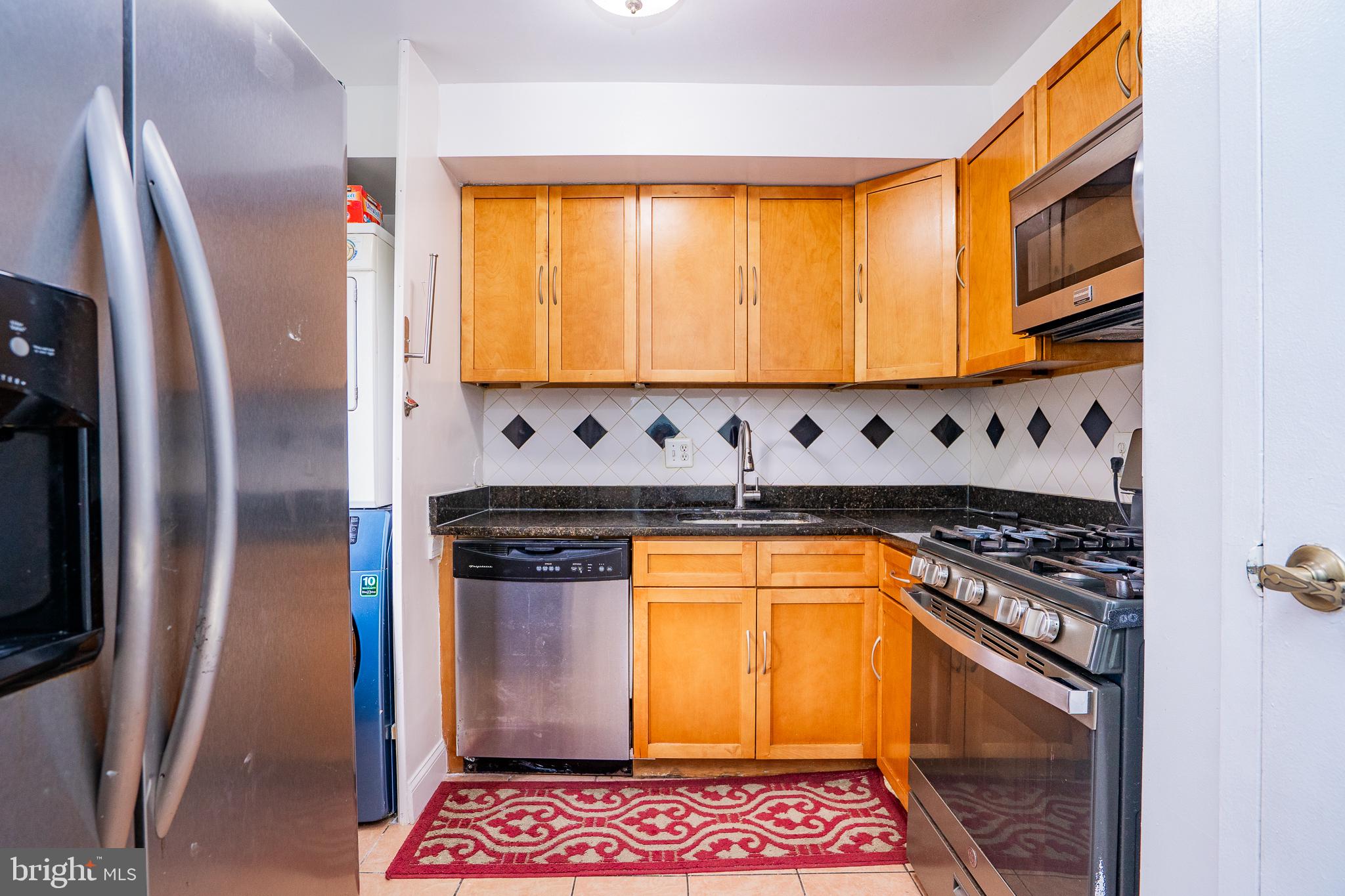 3960 Bel Pre Road, Unit 1 Silver Spring, MD 20906 - Photo 23 of 33 Modern kitchen with sleek finishes.