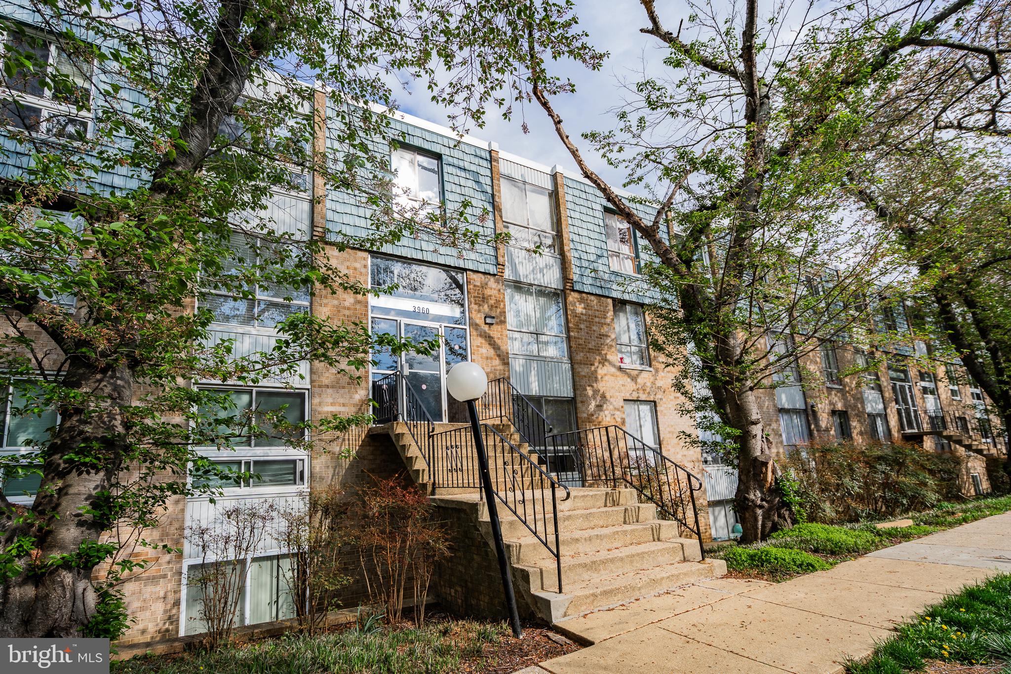 3960 Bel Pre Road, Unit 1 Silver Spring, MD 20906 - Photo 5 of 33 Charming townhouse with lush greenery.