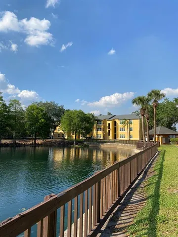 a view of a lake with a house in the background