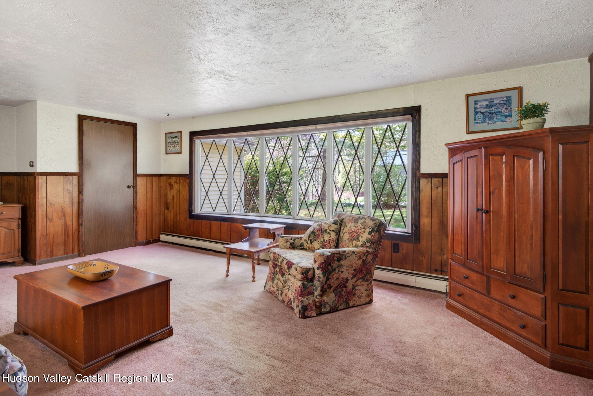 689 Old Road Windham, NY 12496 - Photo 13 of 42 a living room with furniture and large windows