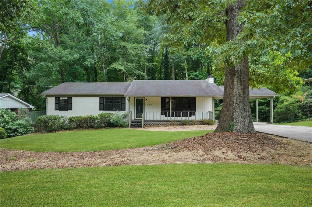 537 Carlouetta Road Mableton, GA 30126 - Photo 1 of 1 a front view of a house with a yard and porch