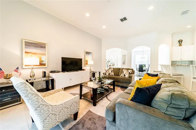 a kitchen with stainless steel appliances kitchen island granite countertop a sink and cabinets