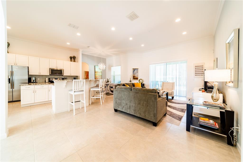 4027 Oakrise Loop Davenport, FL 33837 - Photo 10 of 66 a living room with furniture and a flat screen tv