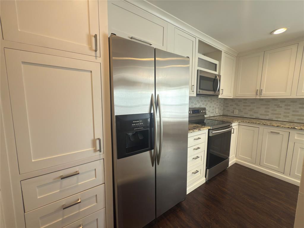 12480 Abrams Road, Unit 2922 Dallas, TX 75243 - Photo 11 of 25 a kitchen with a refrigerator sink and cabinets