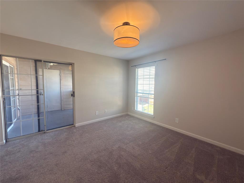 12480 Abrams Road, Unit 2922 Dallas, TX 75243 - Photo 15 of 25 an empty room with window mirror and windows