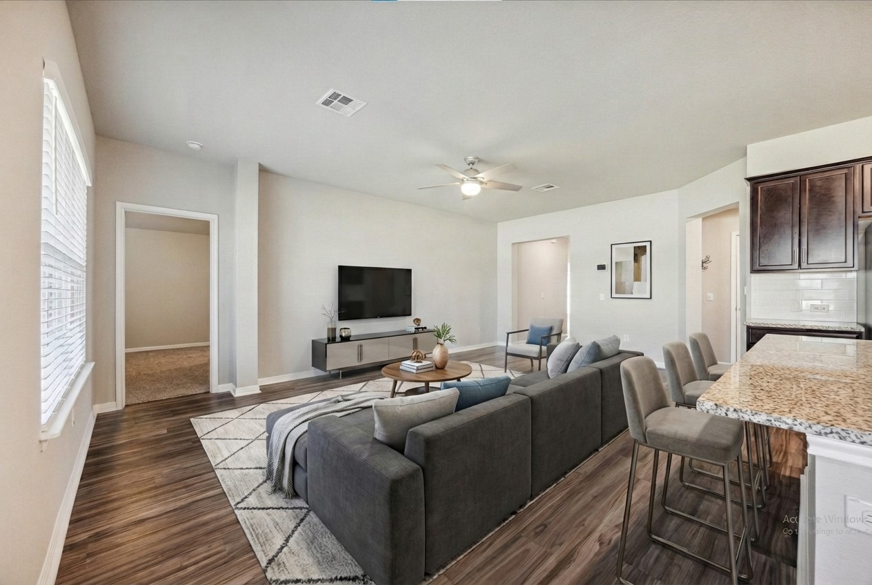 329 Empress Tree Drive Leander, TX 78641 - Photo 5 of 17 Living room with dark wood-type flooring and a ceiling fan