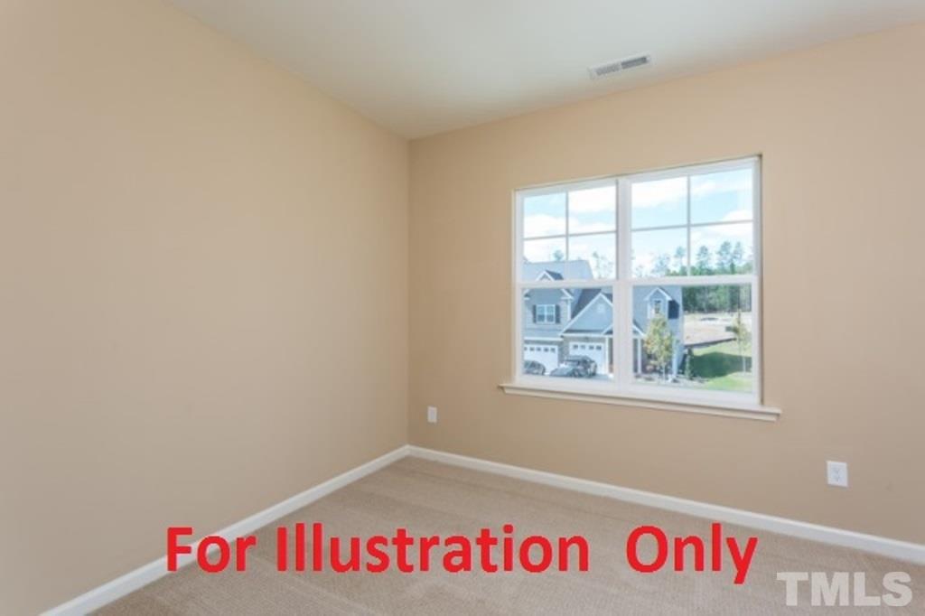 205 Zante Currant Road Durham, NC 27703 - Photo 16 of 25 a view of an empty room with a window
