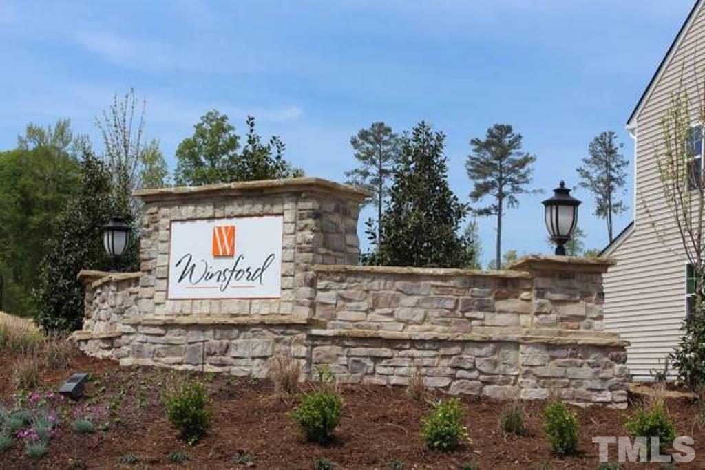 205 Zante Currant Road Durham, NC 27703 - Photo 24 of 25 a sign on the side of a road