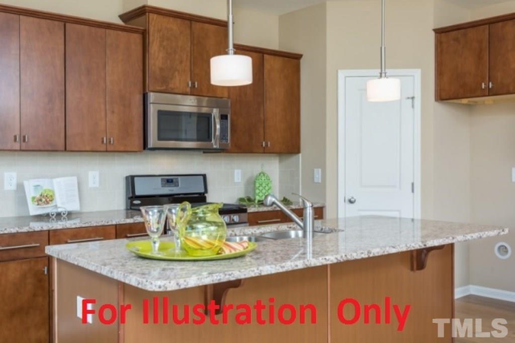 205 Zante Currant Road Durham, NC 27703 - Photo 7 of 25 a kitchen with a granite countertop sink and a granite counter tops