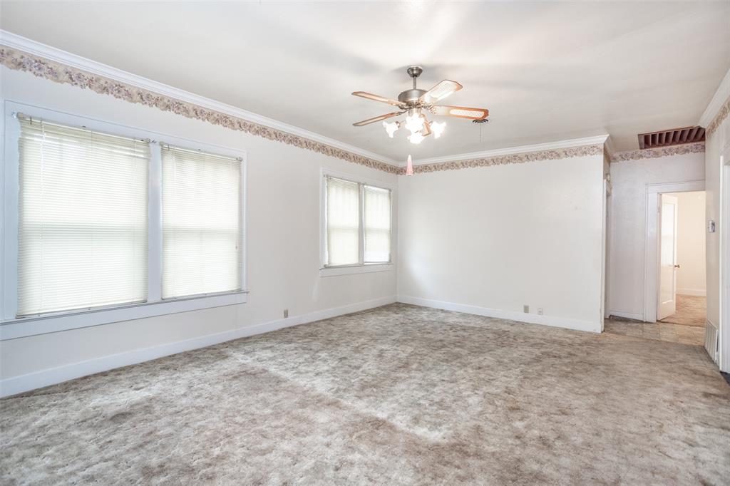 206 Ritchey Street Gainesville, TX 76240 - Photo 6 of 36 a view of an empty room with a window