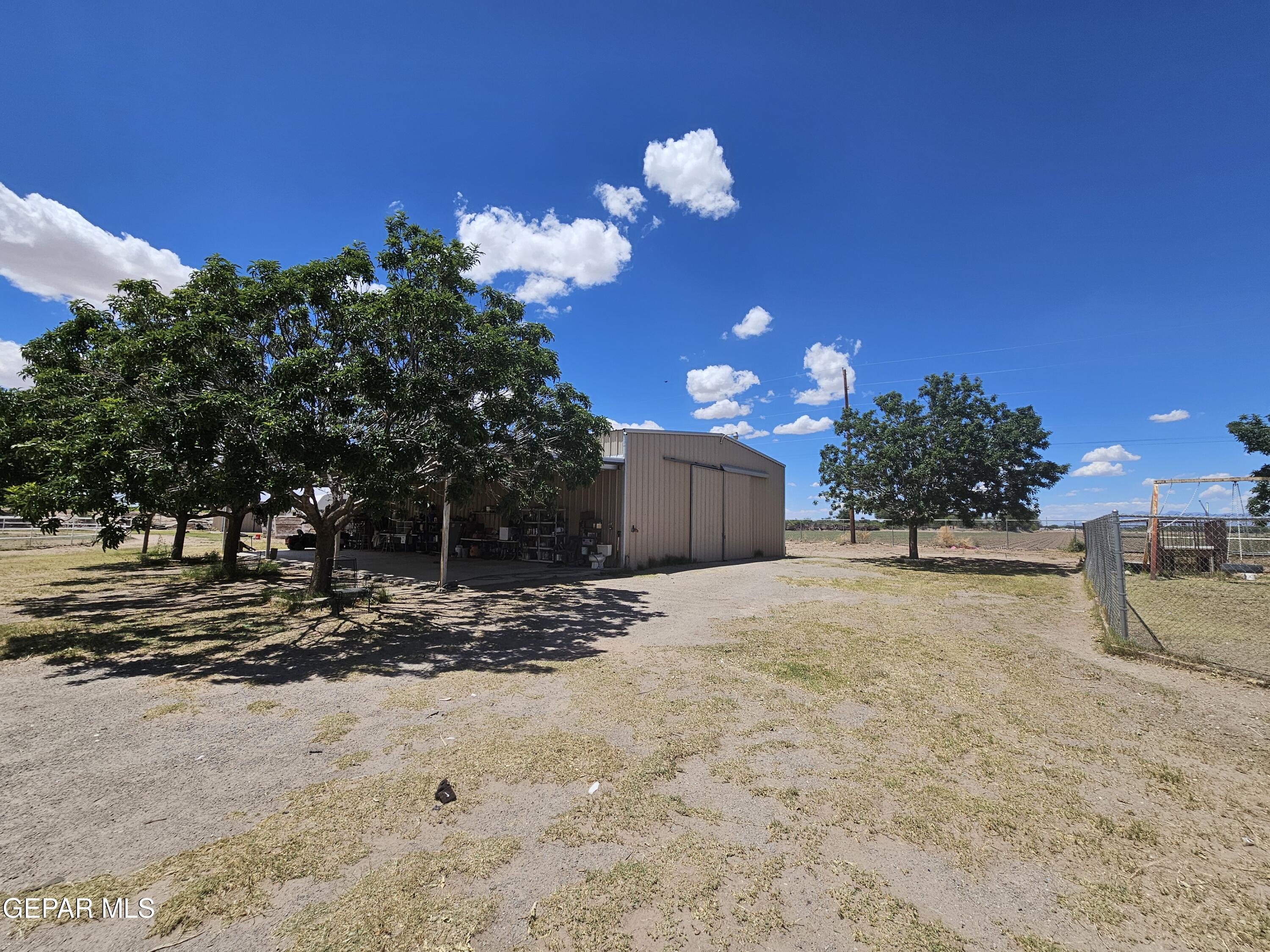6651 Strahan Road El Paso, TX 79932 - Photo 14 of 60 a view of a house with a yard