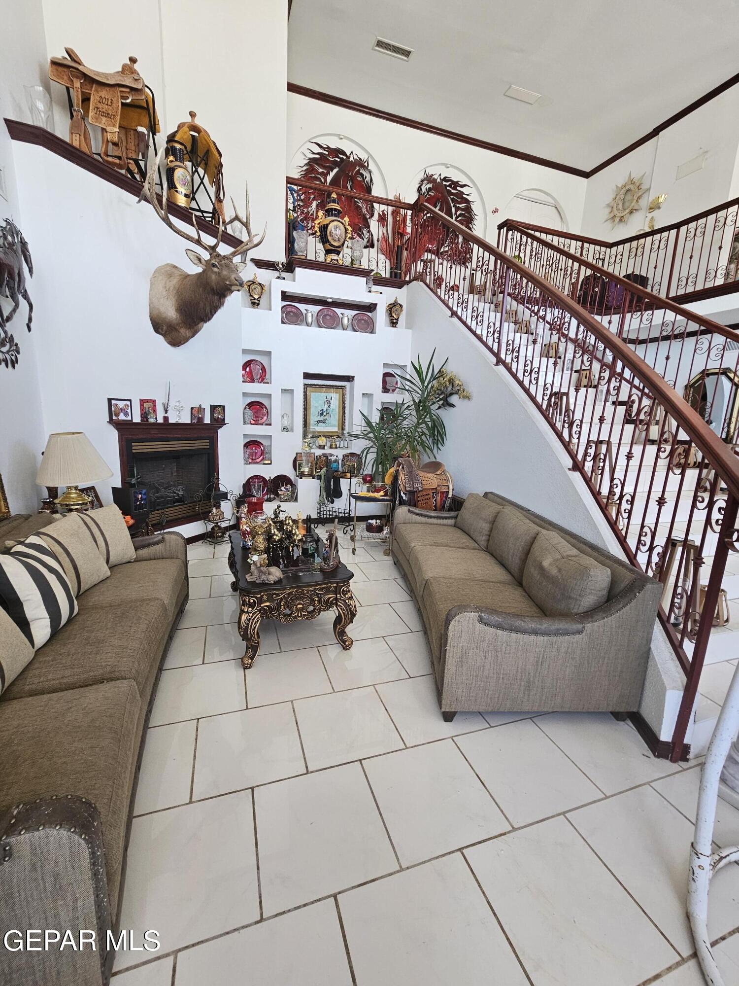 6651 Strahan Road El Paso, TX 79932 - Photo 30 of 60 a living room with furniture and a flat screen tv