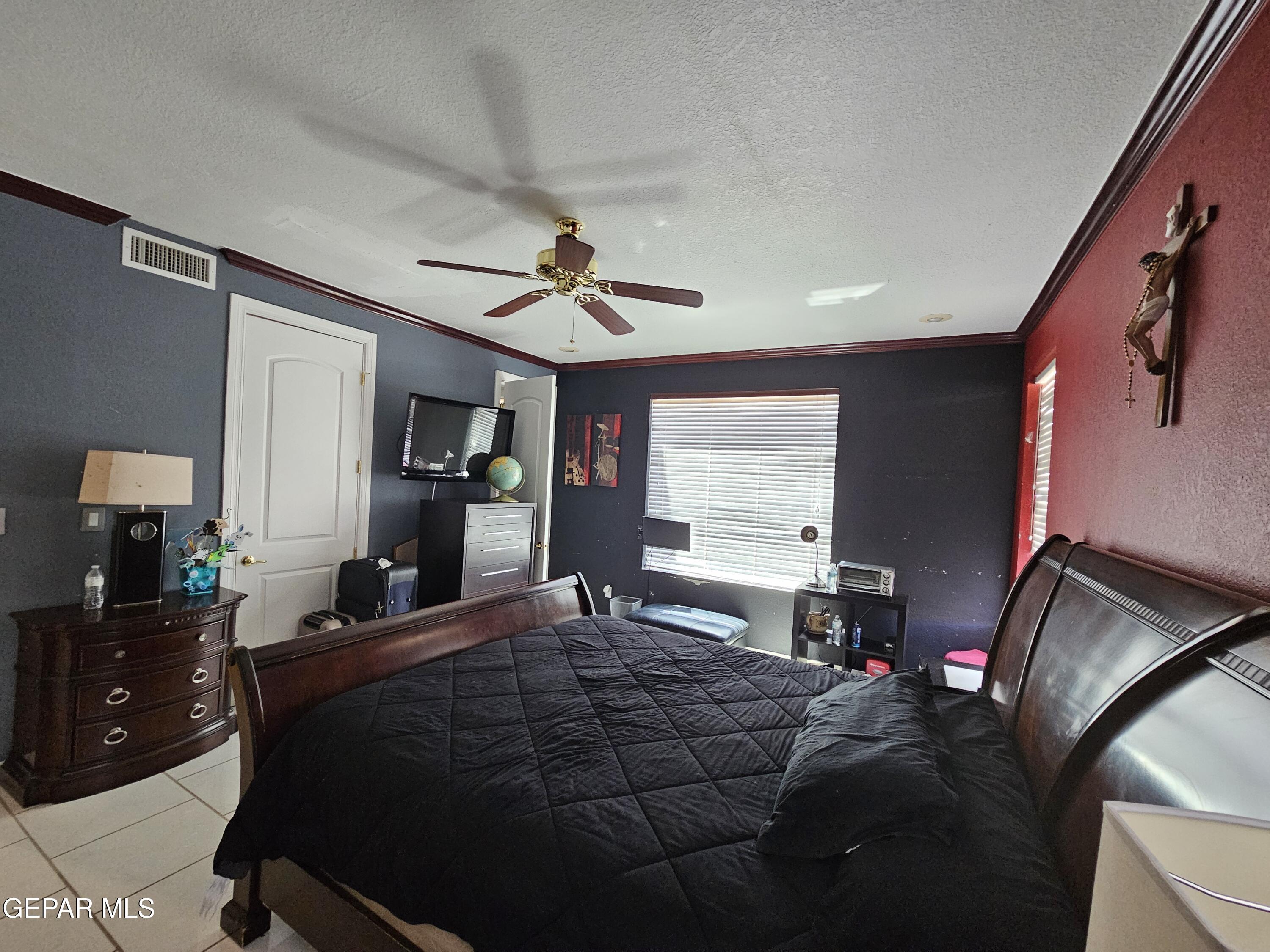 6651 Strahan Road El Paso, TX 79932 - Photo 40 of 60 a bedroom with a bed and window