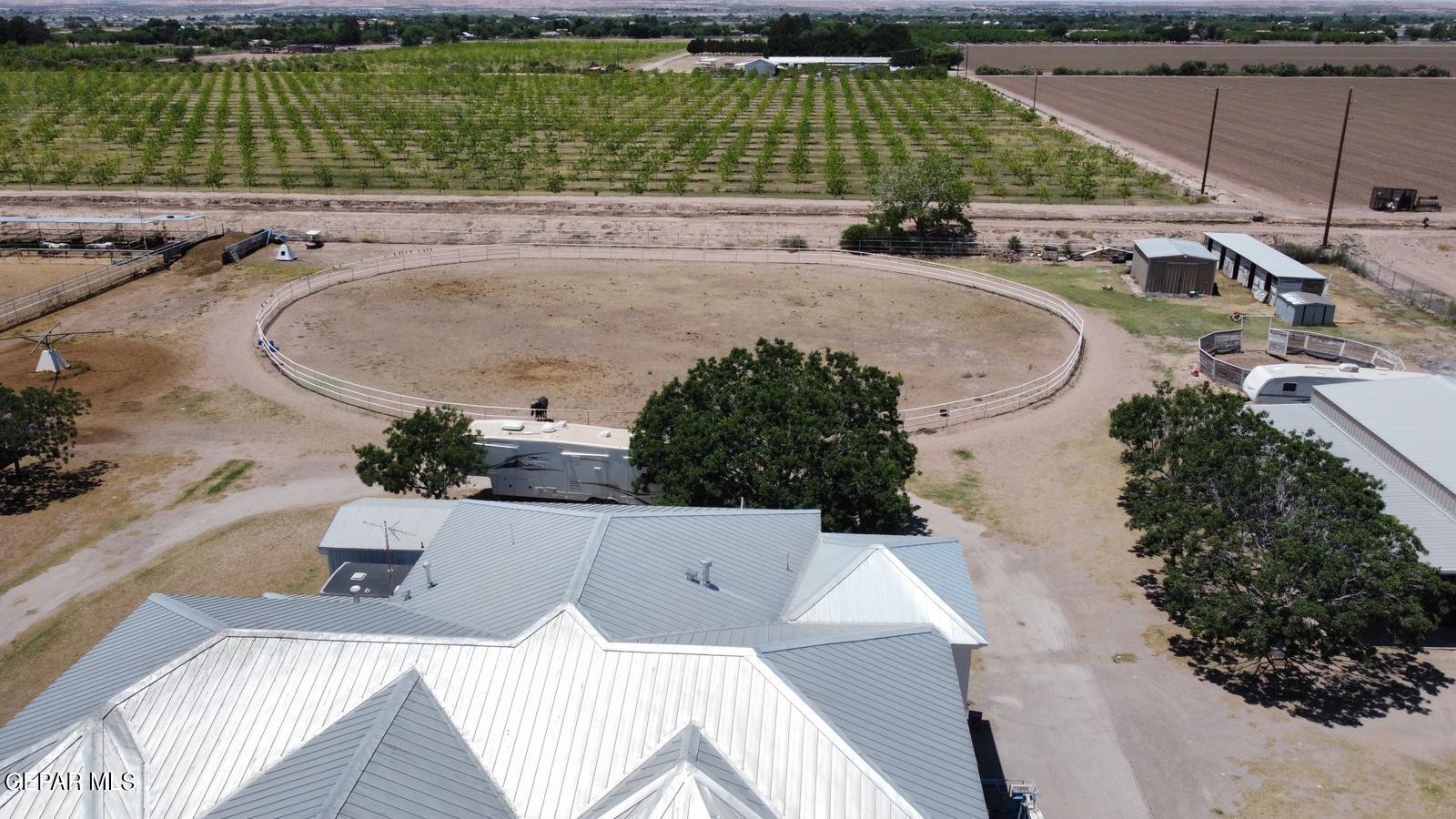 6651 Strahan Road El Paso, TX 79932 - Photo 4 of 60 an aerial view of a swimming pool with a yard