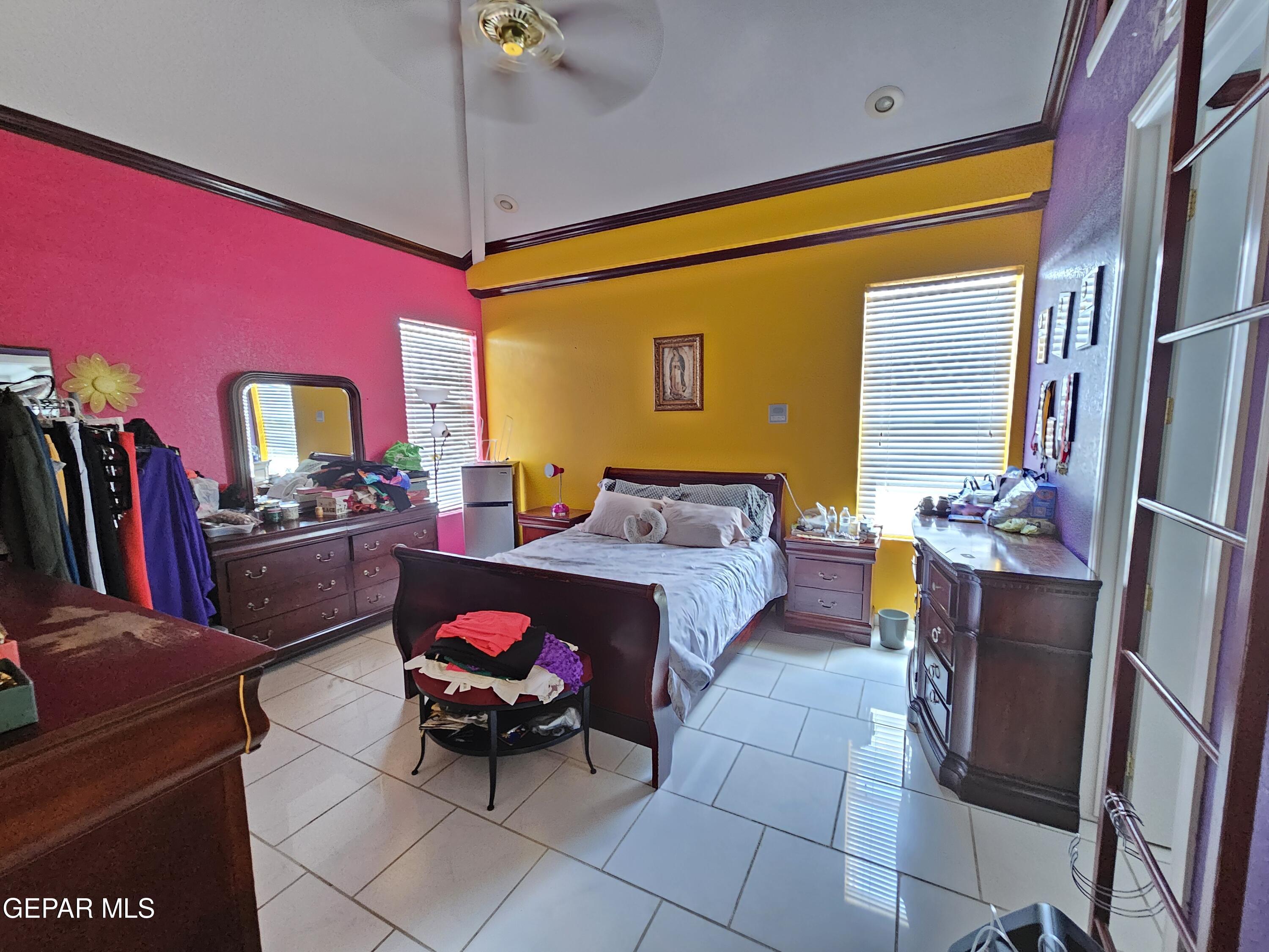 6651 Strahan Road El Paso, TX 79932 - Photo 45 of 60 a living room with furniture a chandelier and a flat screen tv