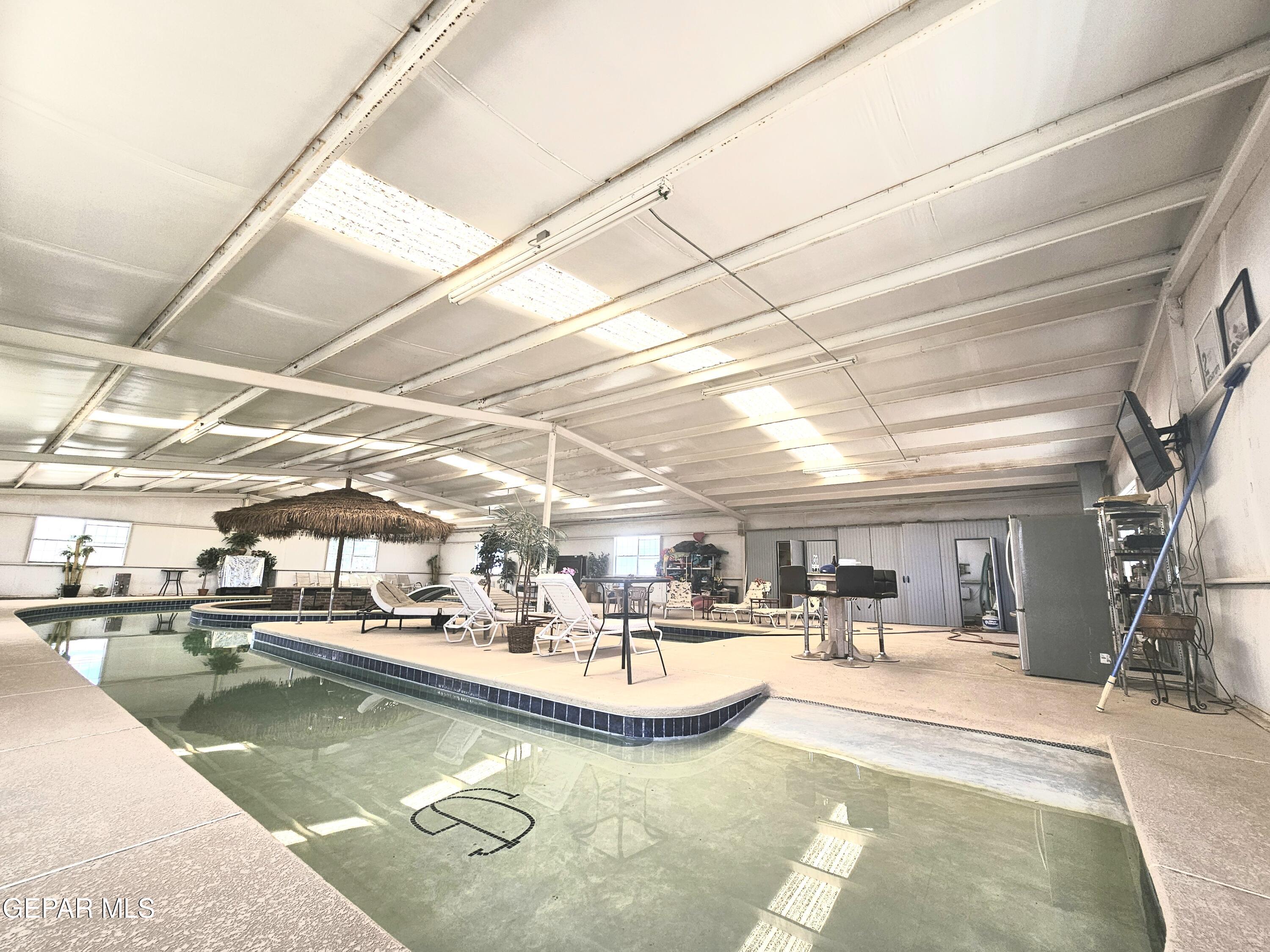 6651 Strahan Road El Paso, TX 79932 - Photo 57 of 60 a view of a swimming pool with outdoor seating