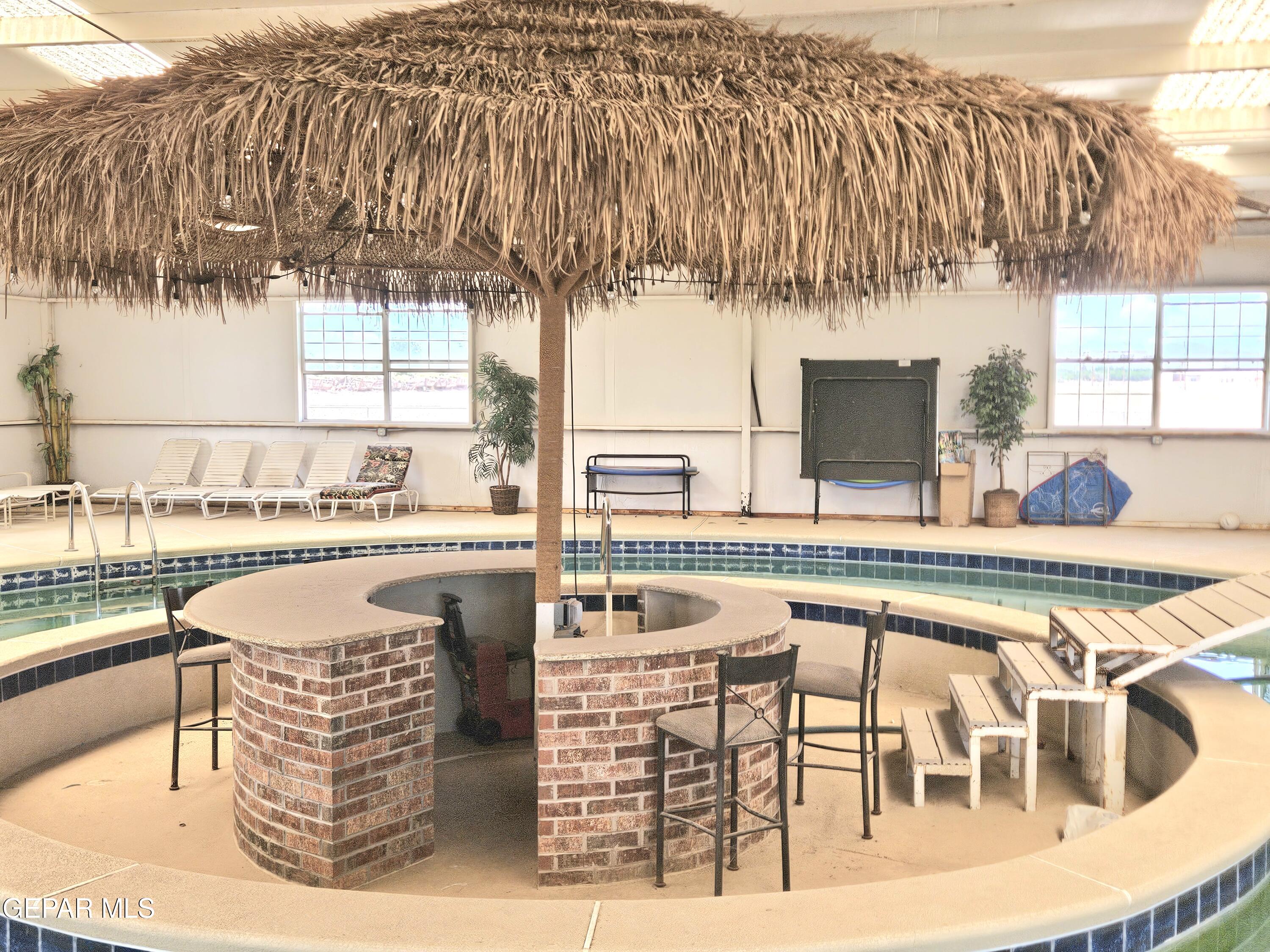 6651 Strahan Road El Paso, TX 79932 - Photo 58 of 60 a dining room with furniture and a large window