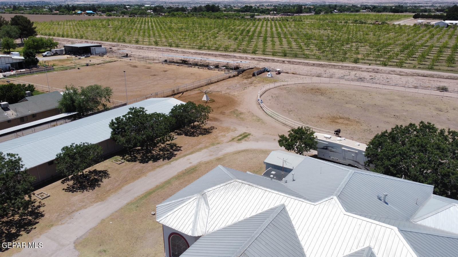 6651 Strahan Road El Paso, TX 79932 - Photo 6 of 60 an aerial view of a house with a garden and lake view