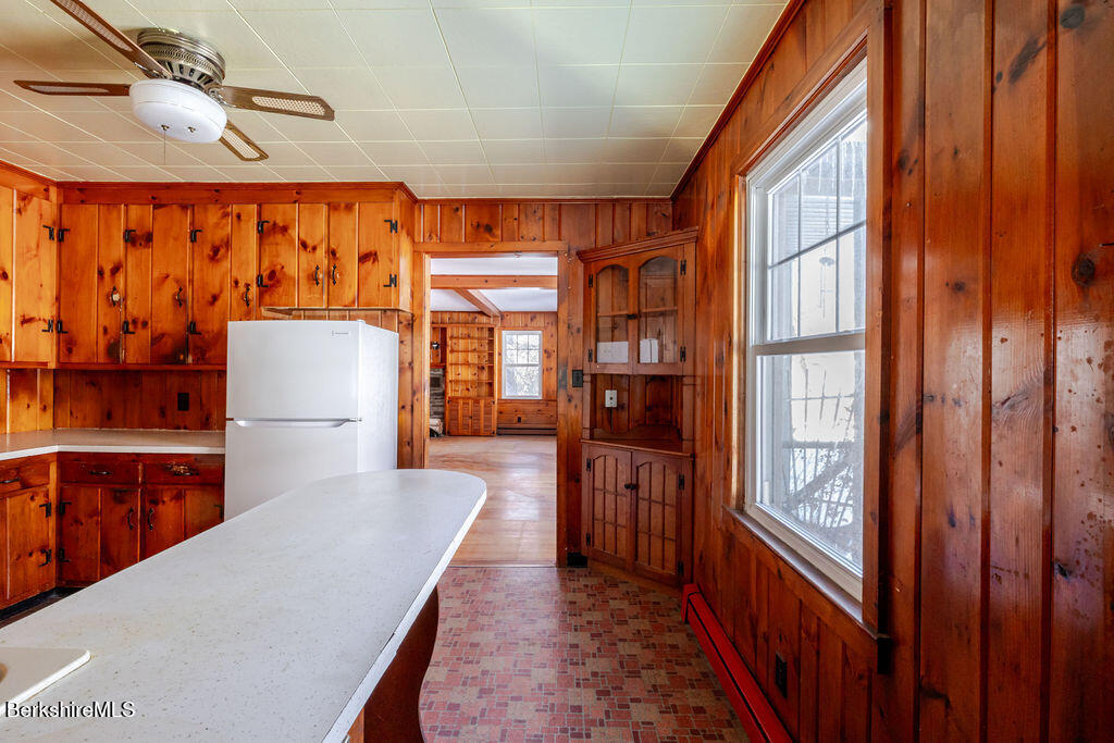 470 Main Road Monterey, MA 01245 - Photo 17 of 44 a close view of a kitchen with furniture and staircase