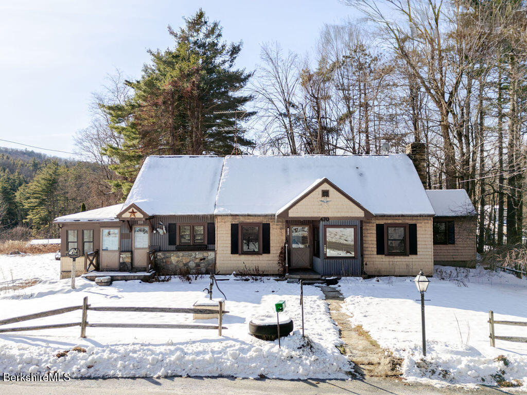 470 Main Road Monterey, MA 01245 - Photo 2 of 44 a front view of a house with a patio