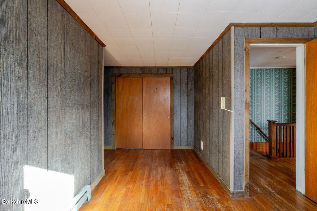 470 Main Road Monterey, MA 01245 - Photo 33 of 44 a view of a hallway with wooden floor and closet