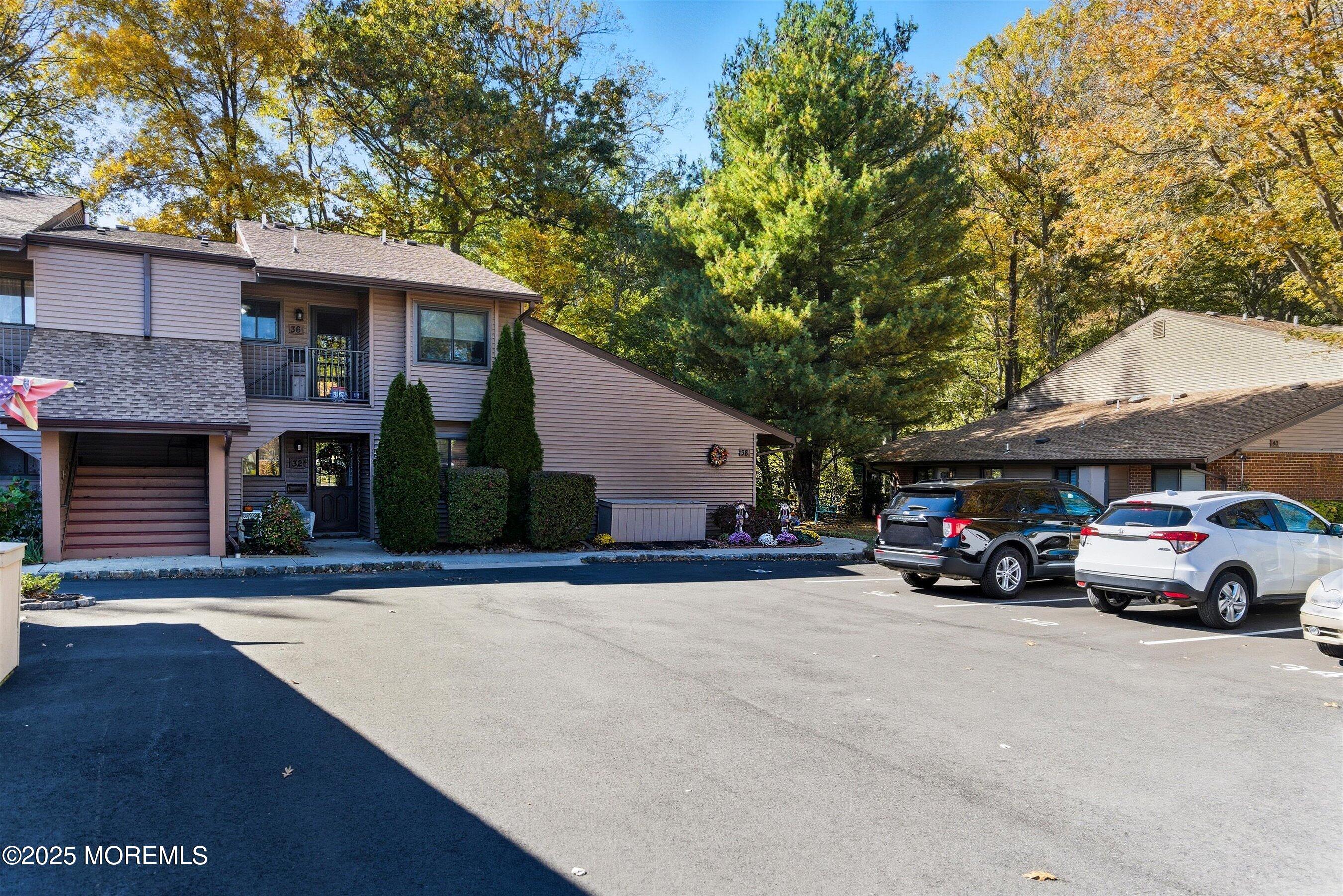 32 Ellsworth Court Red Bank, NJ 07701 - Photo 2 of 32 a view of a cars park in front of a building